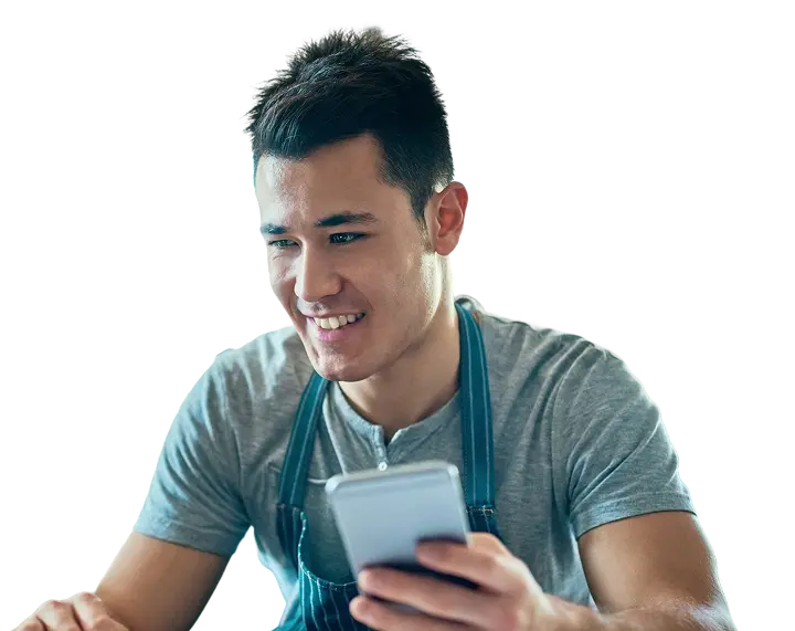 Content creator with camera looking at phone
