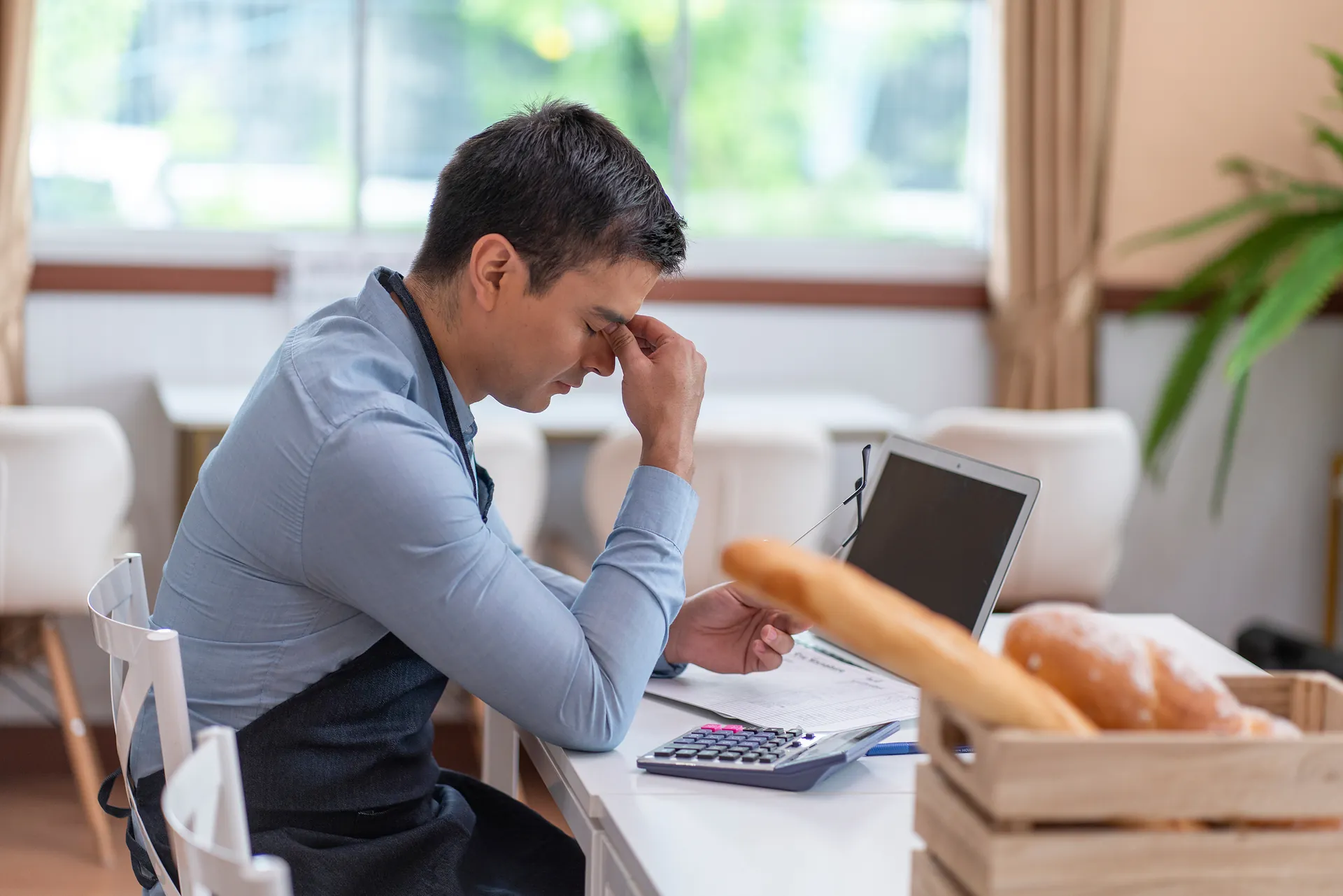 Stressed woman at laptop