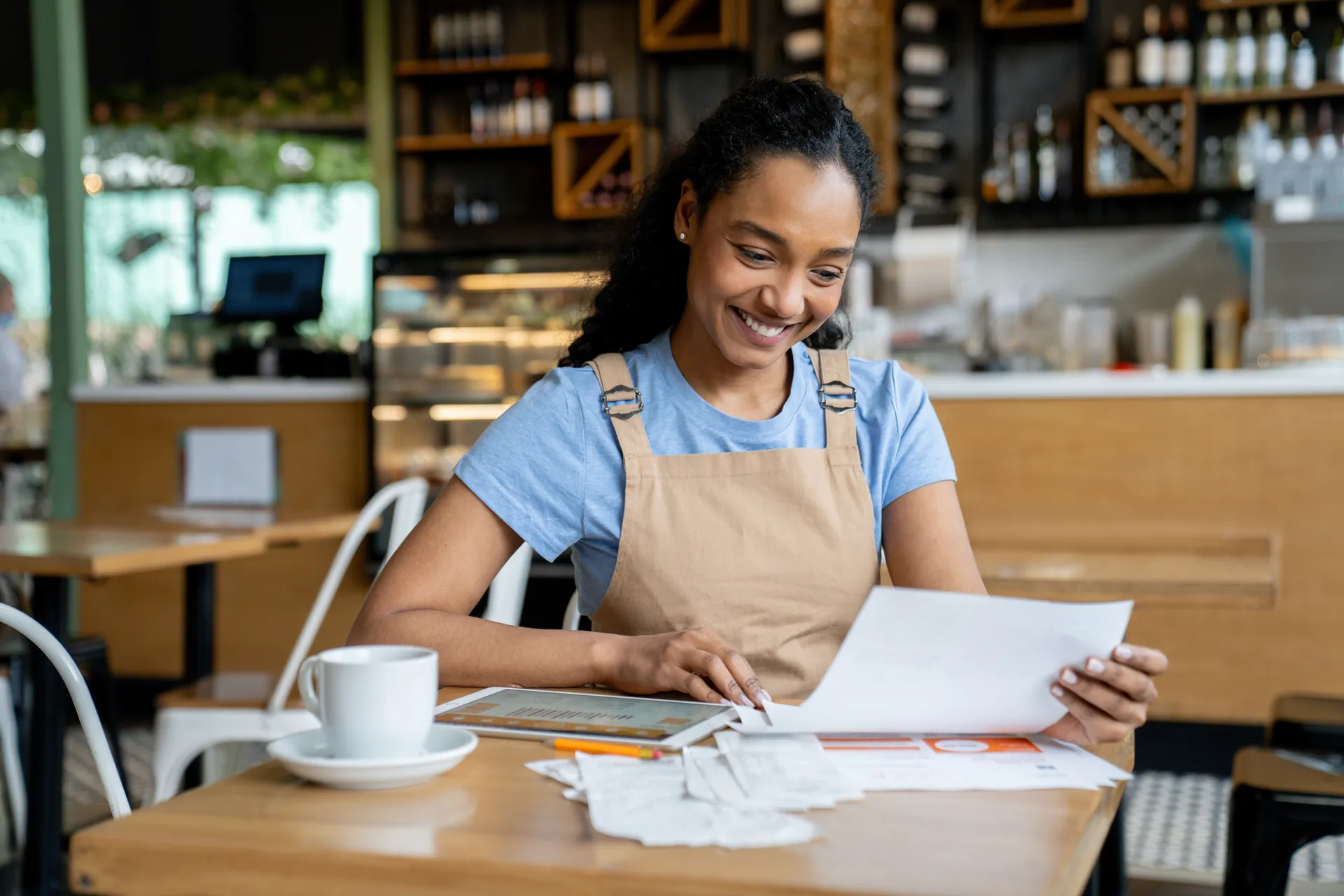 Happy woman looking at tablet
