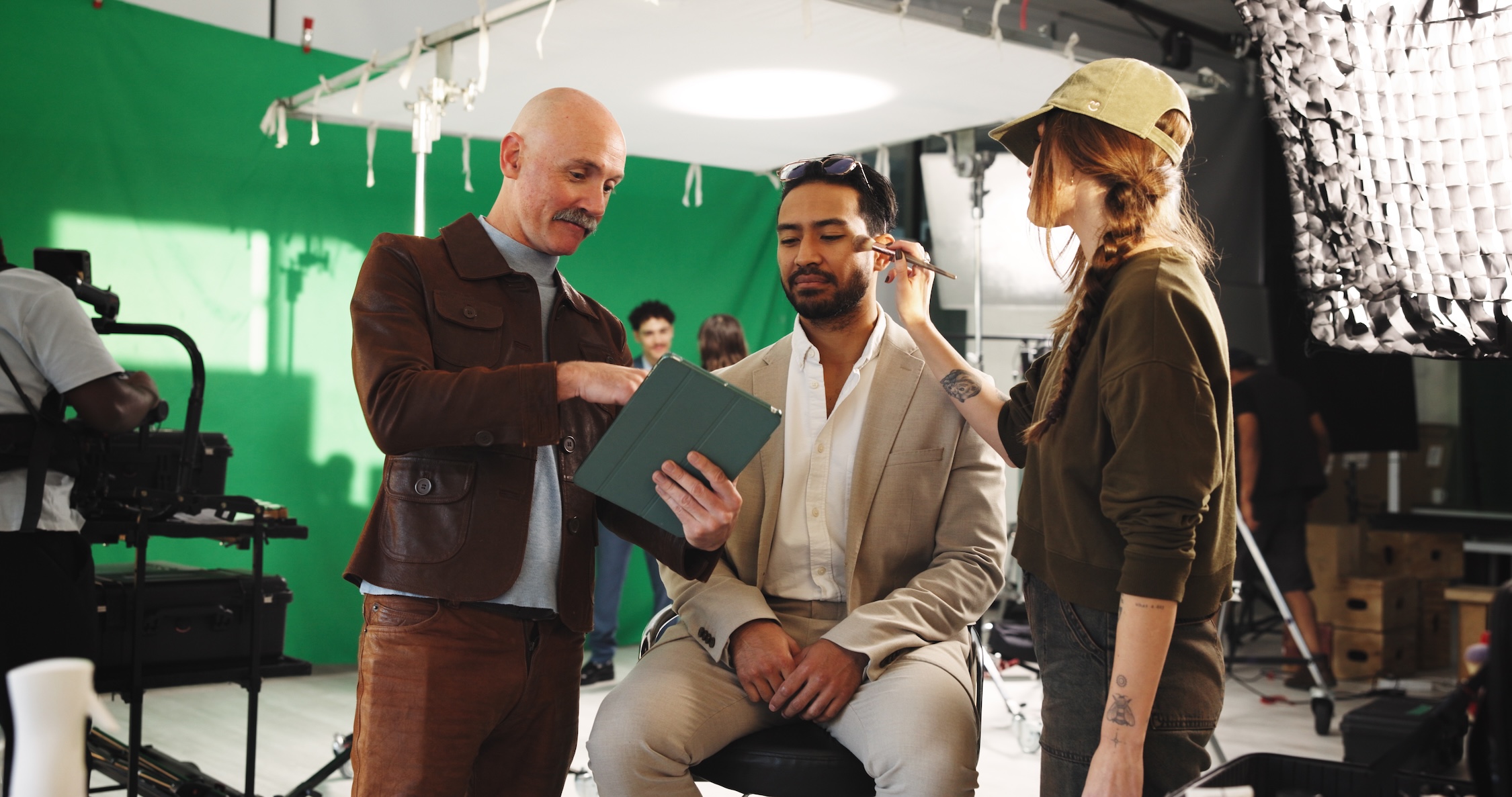 Group of people discussing while looking at an ipad